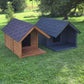 Two dog houses, one brown and one blue, on a grassy area with trees in the background.
