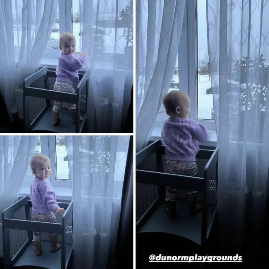 At the window in the tower, watching the snow